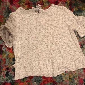 White shirt with black poke-a-dots